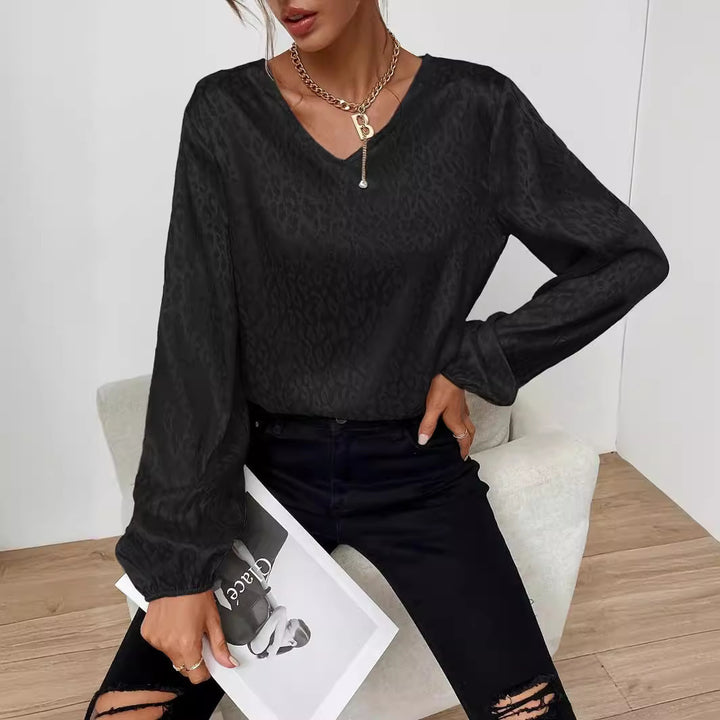 Kvinders elegante bluse top med V-hals og voluminøse ærmer Stilla