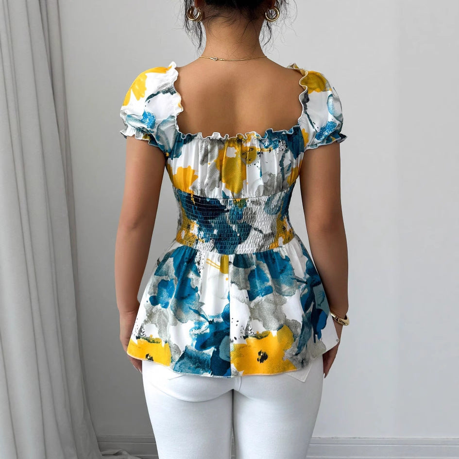 Kvinders bluse med blomsterflæser og elastisk talje Stilla