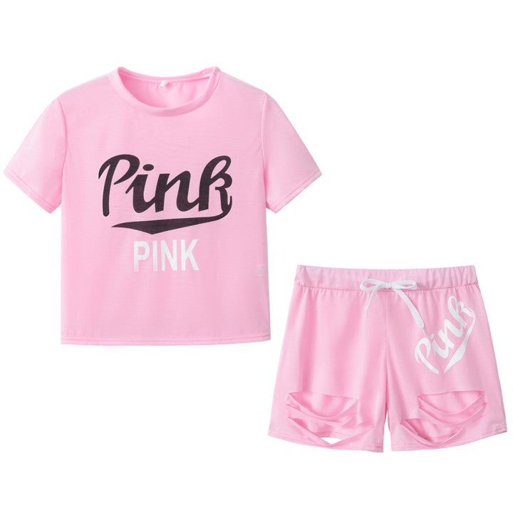 Damer sporty t-shirt og shorts sæt med løs pasform og kontrastprint Stilla