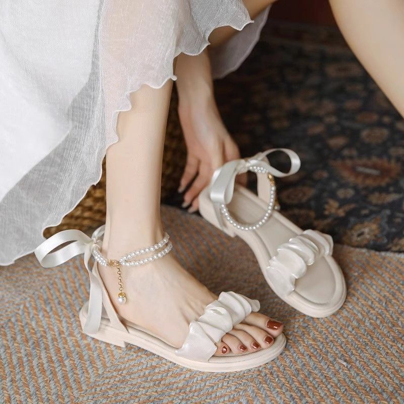 Dame Riemchen-sandaler med modigt flæse-design og elegante perle-accenter Stilla