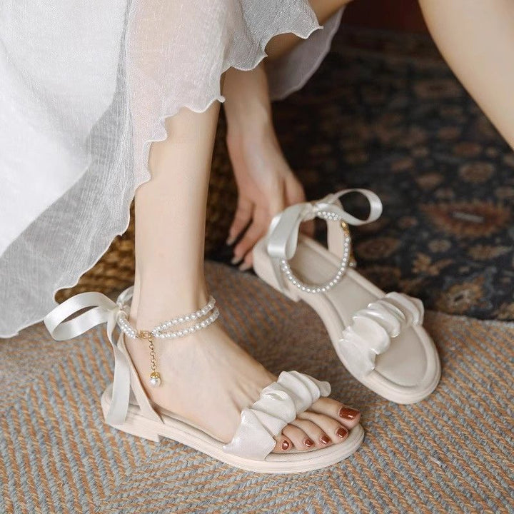 Dame Riemchen-sandaler med modigt flæse-design og elegante perle-accenter Stilla