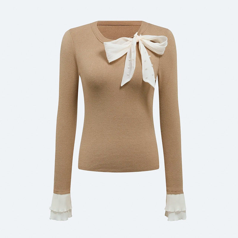 Kvinders elegante top med chic bueapplikation Stilla