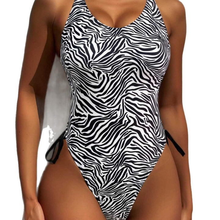 Dame one-piece badedragt med spændende zebra-design og høj benudskæring Skovae