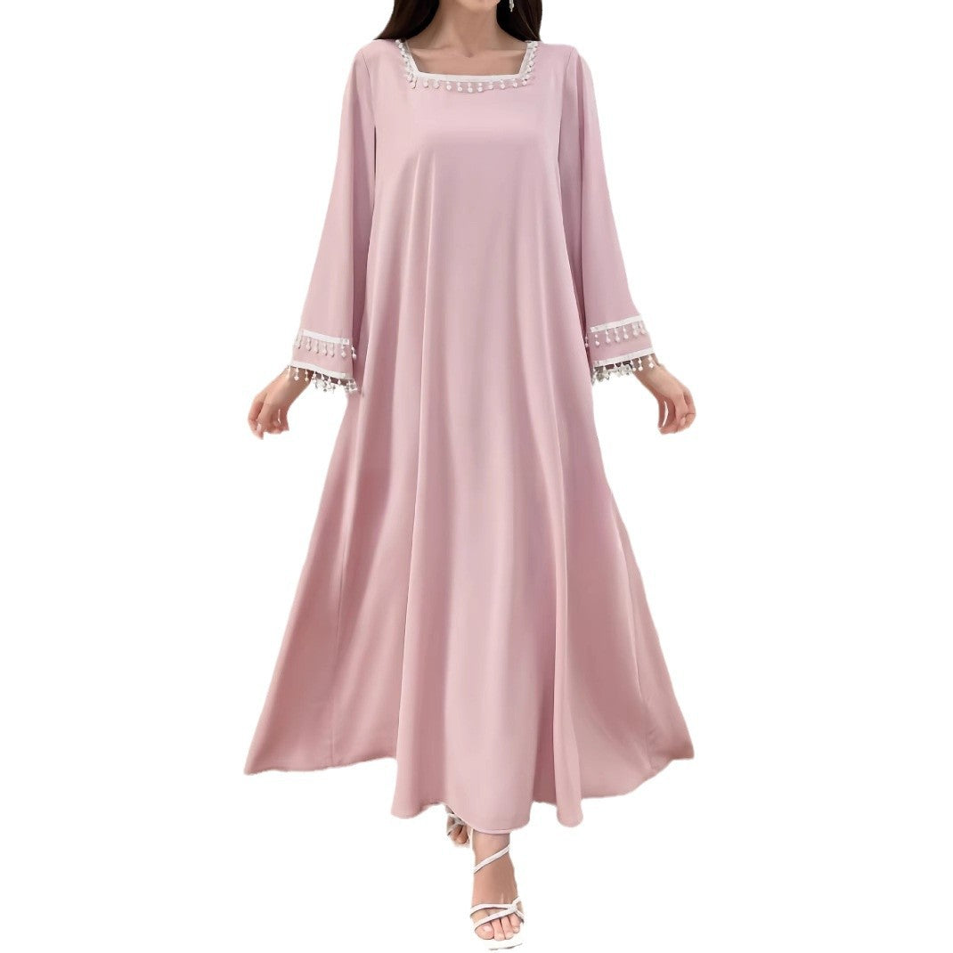 Kvindelige elegante maxi kjoler med dekorative franje og brede ærmer
