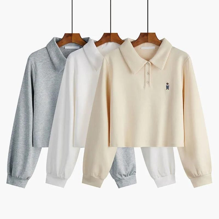 Dame skåret langærmet polo-top med stilfuld broderi Stilla
