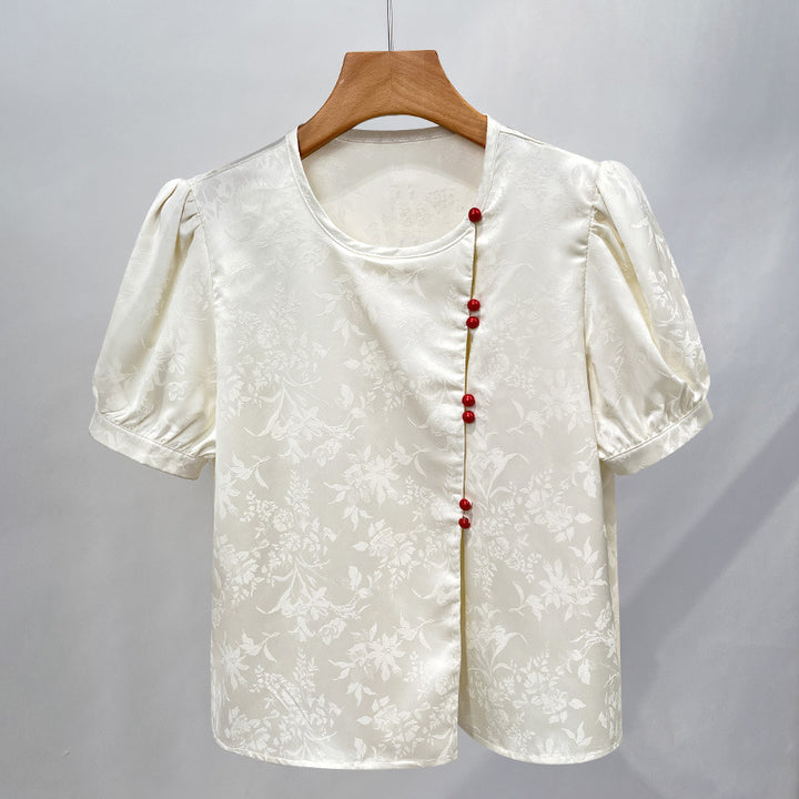Damebluse med elegant struktur og dekorative knapper Stilla