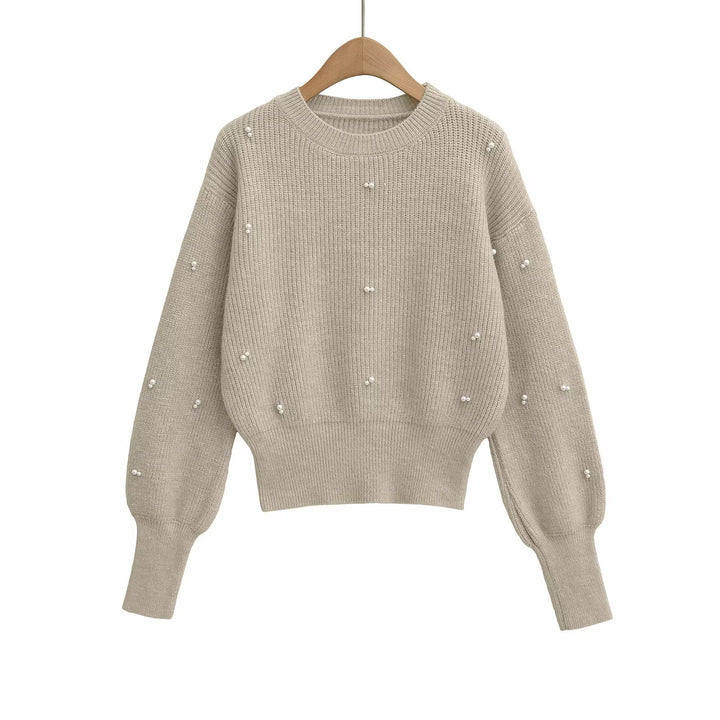 Dame modisk strikpullover med elegante perledetaljer Stilla