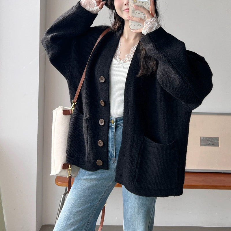 Kvindernes chunky strikket cardigan med elegante knapdetaljer og praktiske lommer Stilla