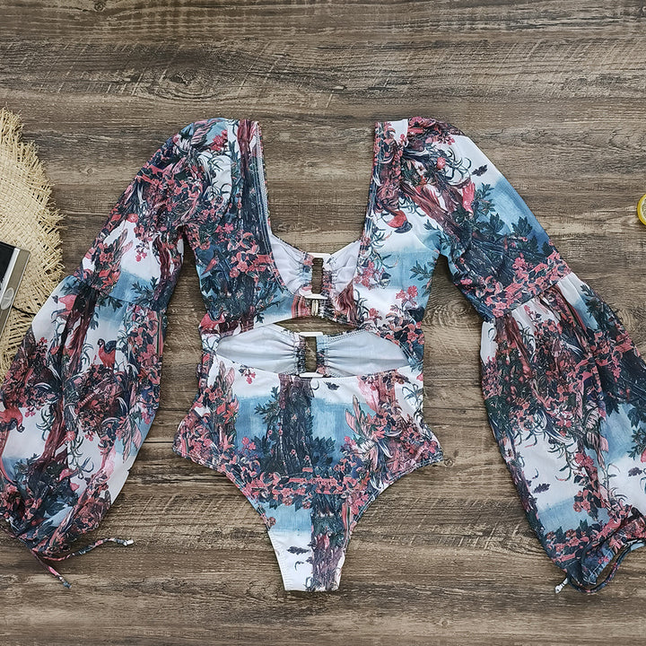Dame én-delt badeshorts med glamorøs cut-out-design og elegante puffærmer Stilla
