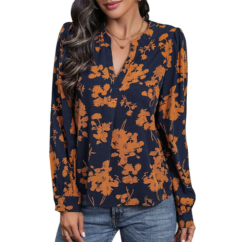 Damebluse med blomstertryk og elegante pufærmer Stilla