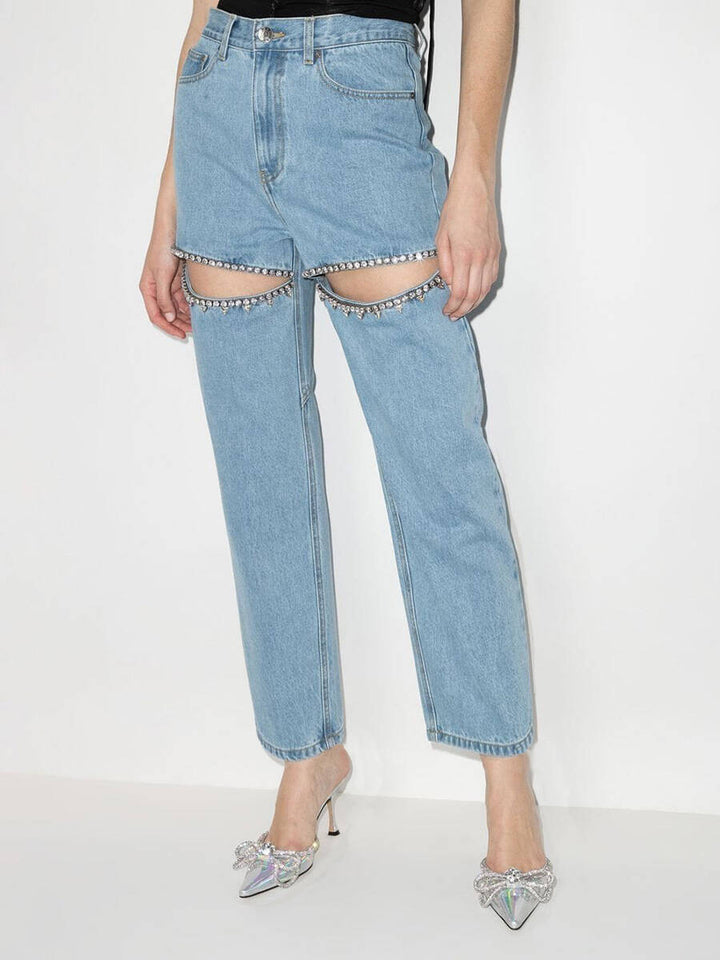 Dame jeans med ekstravagant snit og glitrende decorationer