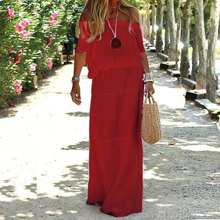 Dame Off-Shoulder Maxikjole med flydende snit og elegante volangdetaljer Stilla