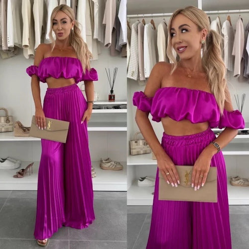 Dame iøjnefaldende top med samlet design og elegant højlivet bukser Stilla