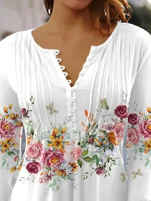 Damebluse med blomsterdesign og elegante knapdetaljer Stilla