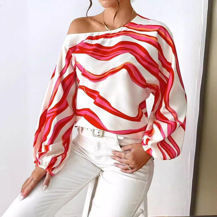 Dame Off-Shoulder-bluse med voluminøse ærmer og moderne stribemønster Stilla