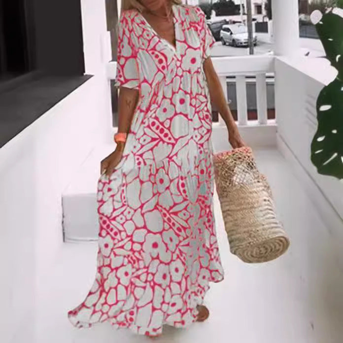 Dame Maxi-kjole med blomsterdesign og svingende kant Stilla