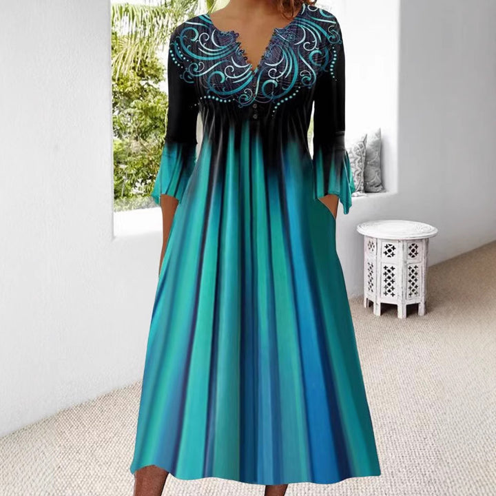 Dame midi kjole med elegant broderi og flydende snit Stilla