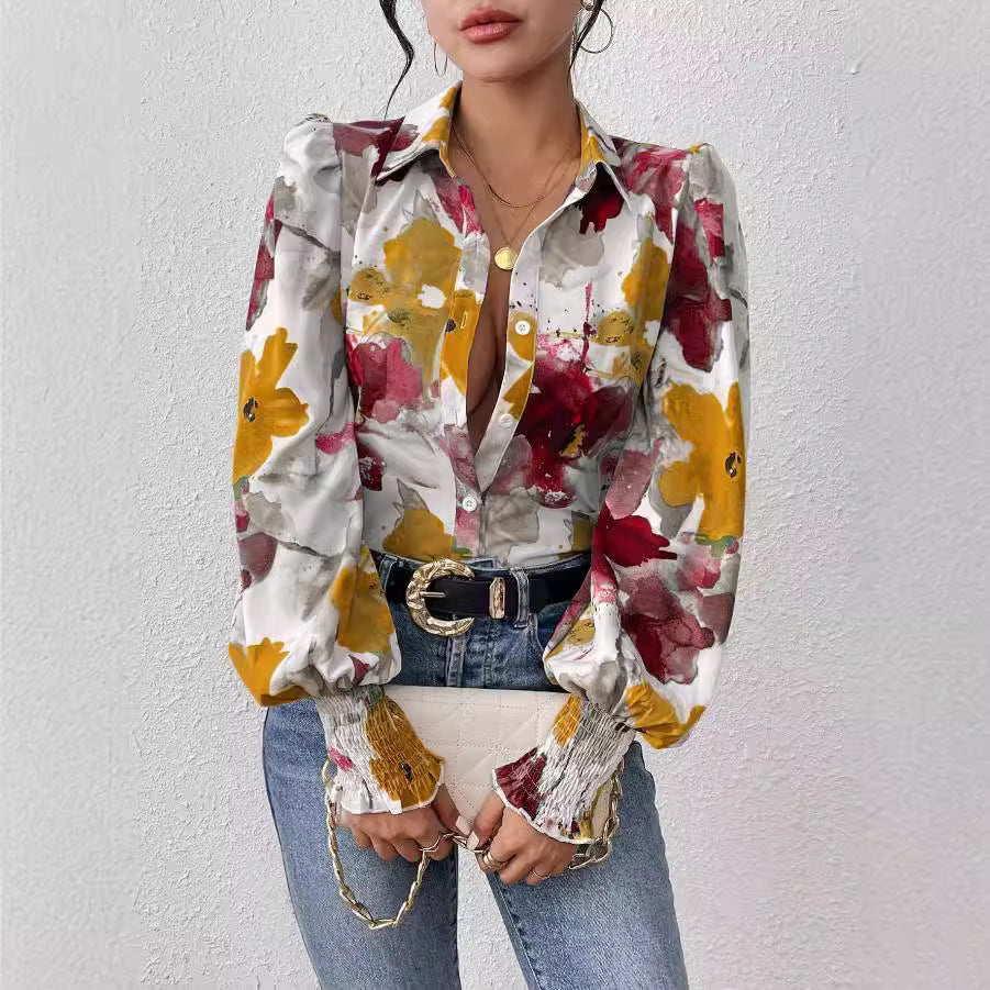 Dame elegant bluse med farverigt floralt design og afslappede puffærmer Stilla