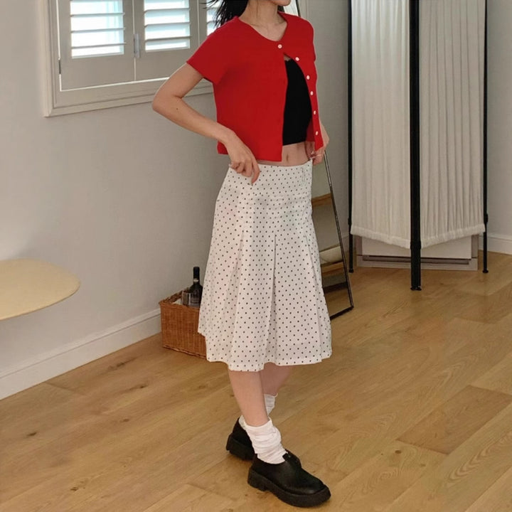 Dame midi skirt with playful polka dot pattern and elegant A-line Skovae