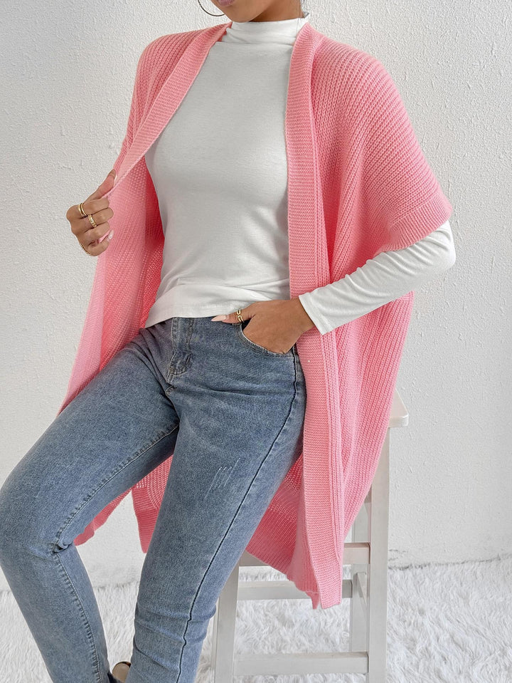 Dame strikjakke i afslappet oversized stil med åben front og sideslids Stilla