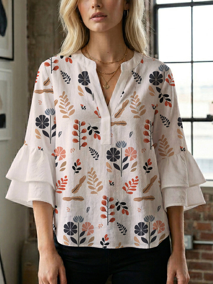 Damebluse med voluminøse rynkede ærmer og moderne motiv Skovae