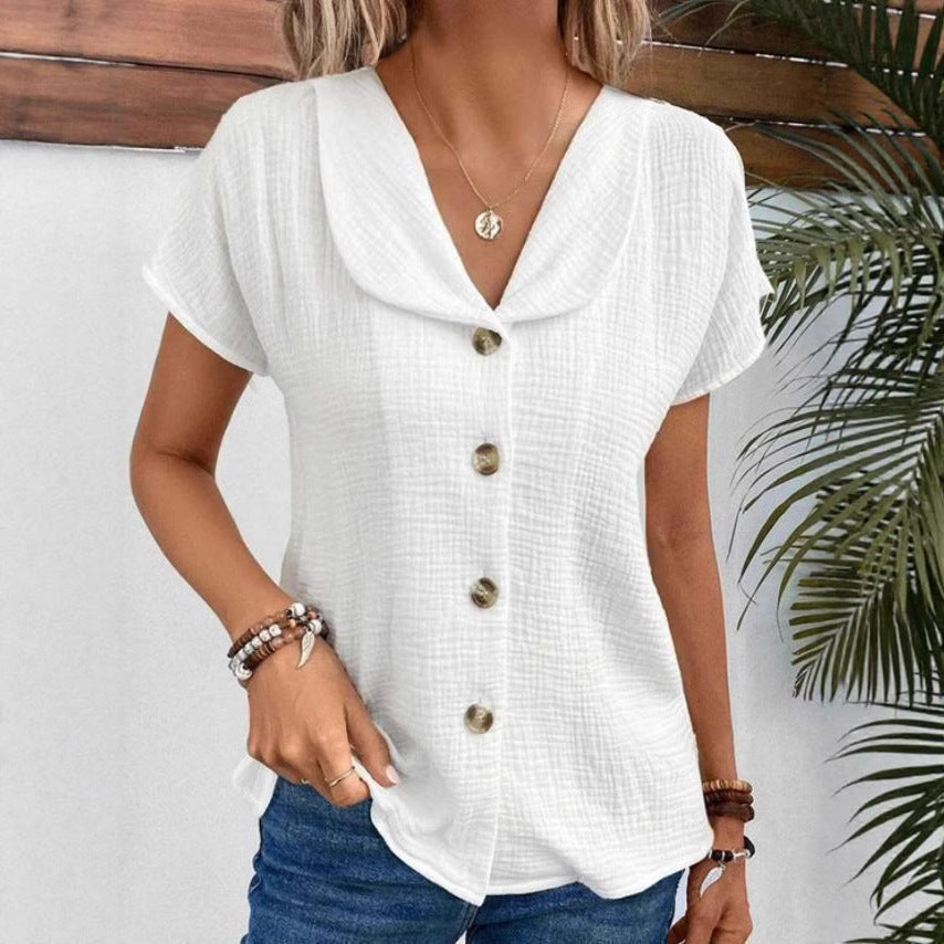 Damebluse med elegant klapkrave og dekorative knapper Stilla