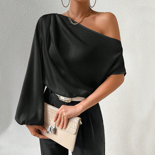 Kvindernes asymmetriske top med elegante puffærmer Stilla