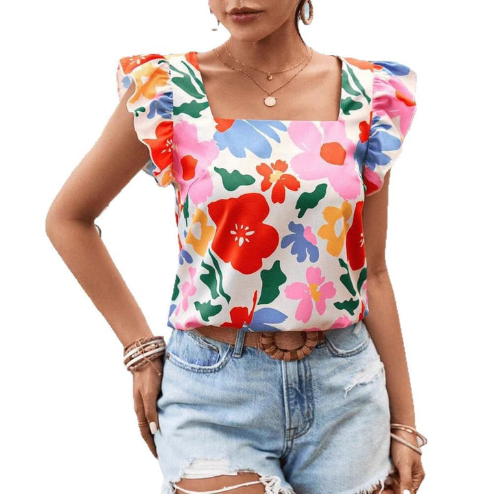 Damebluse med flæsekanter og blomstermotiver Stilla