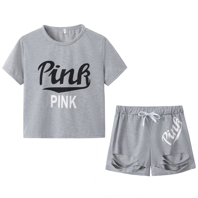 Damer sporty t-shirt og shorts sæt med løs pasform og kontrastprint Stilla