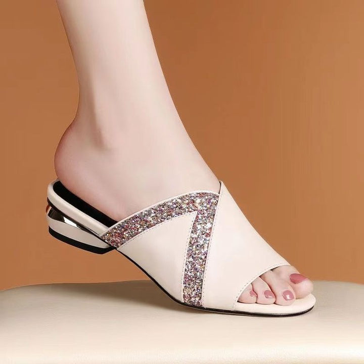 Dame elegante mules med funklerende detalje og svunget design Stilla