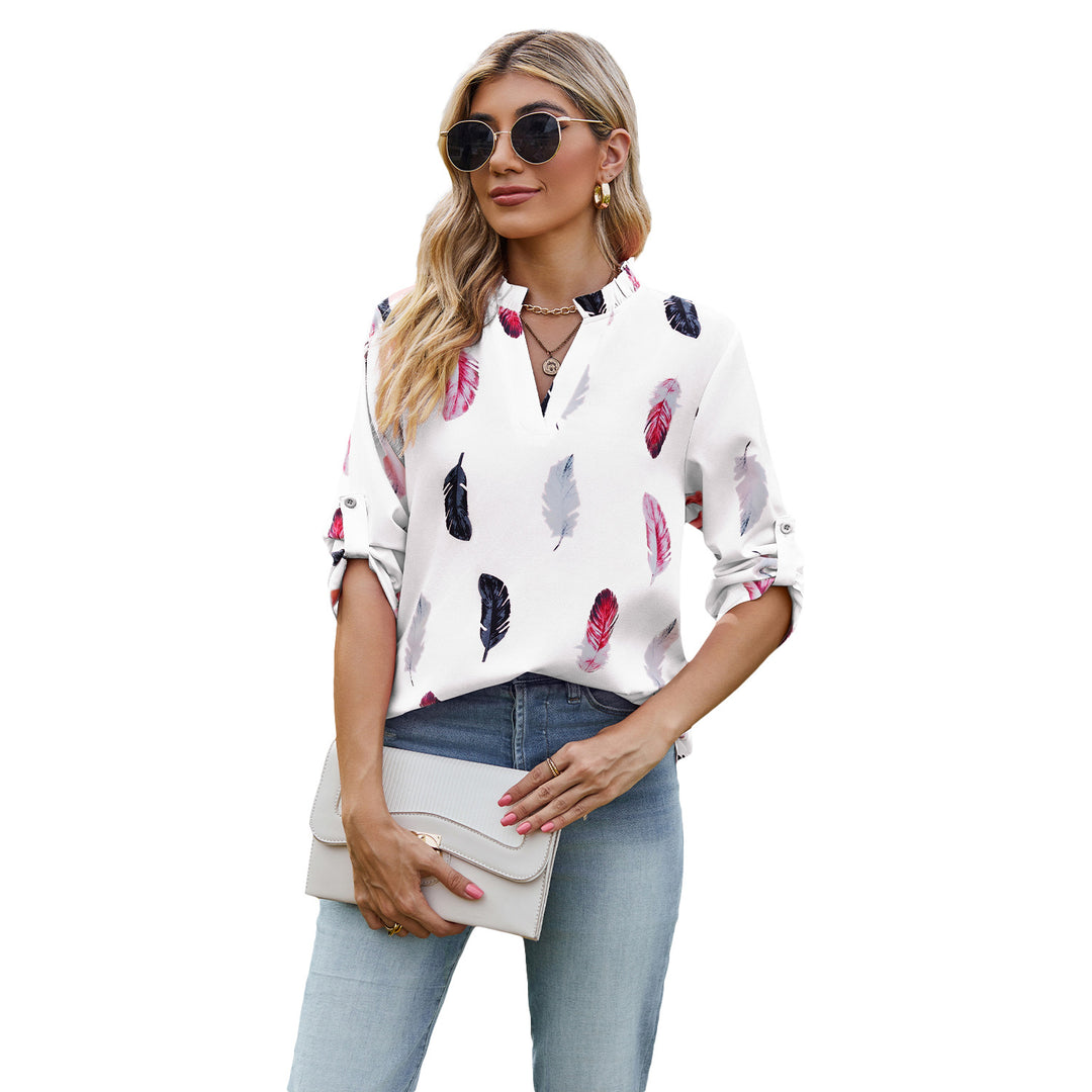 Damebluse med elegant fjerdesign og halvlange ærmer Stilla
