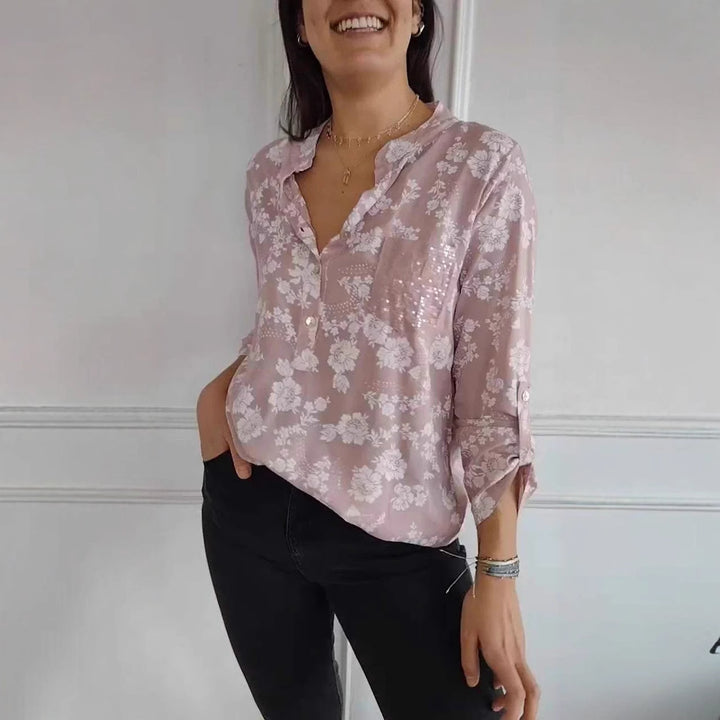 Damebluse med blomsterdesign og glitrende pailletter Stilla