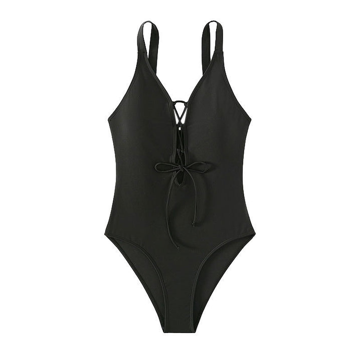 Damer heldragt badedragt med raffinerede snøredetaljer og dyb V-udskæring Skovae