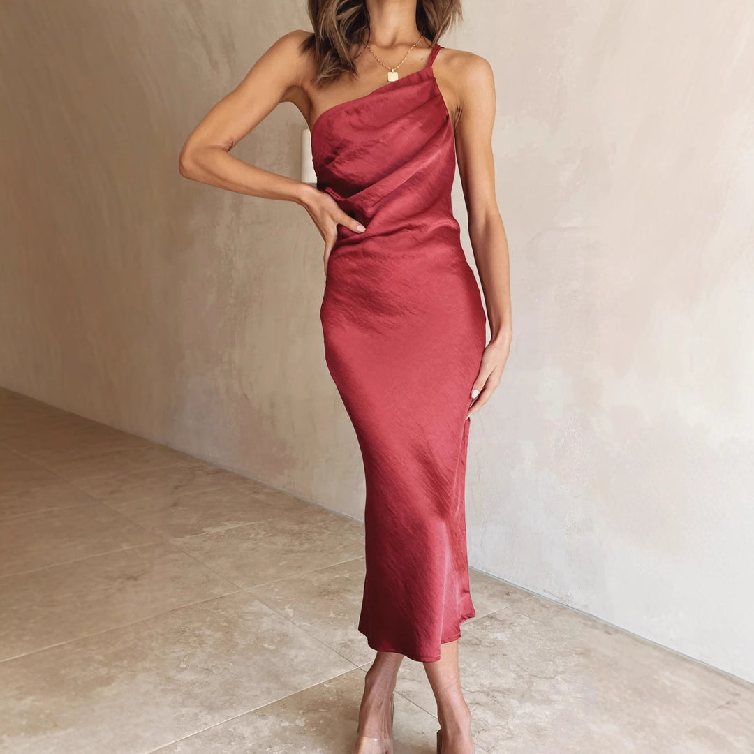 Women's satin midi dress with asymmetrical cut and elegant flair Skovae