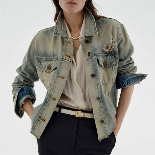 Dame mode denimjakke i vintage-stil med afslappet snit og frynset detaljer Skovae