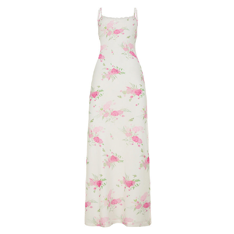 Dame maxikjole med floral design og elegante spaghetti stropper Skovae
