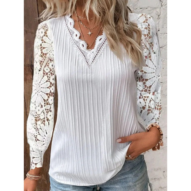 Damebluse med elegante spidse ærmer og længdribstruktur Stilla
