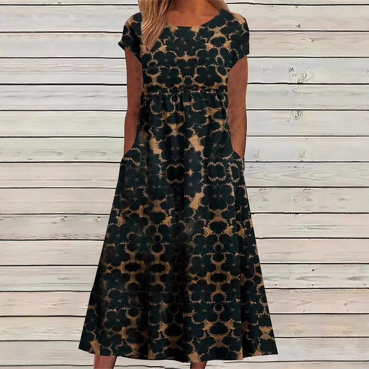 Dame Maxikjole med legende blomsterdesign og praktiske sidelommer Stilla