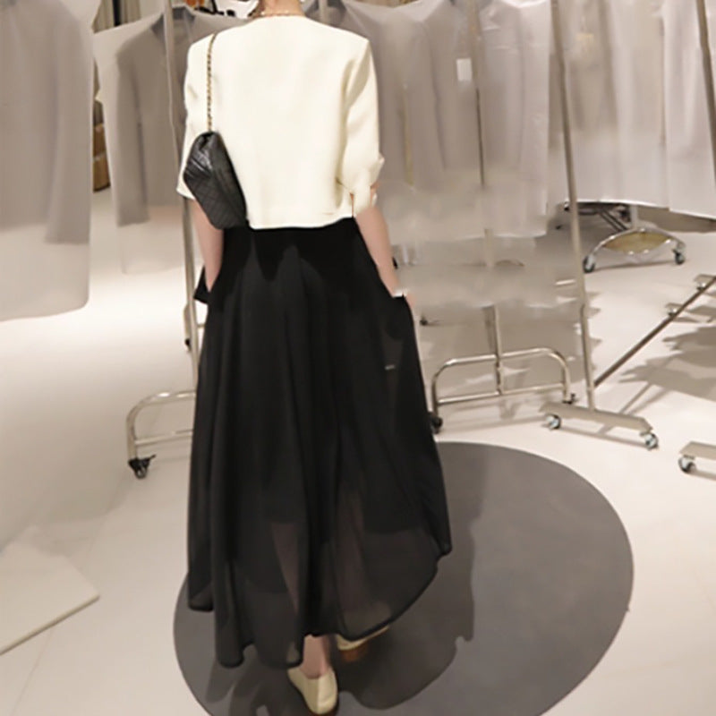 Dame elegant kort jakke med struktureret design og fashionable knapdetaljer Stilla