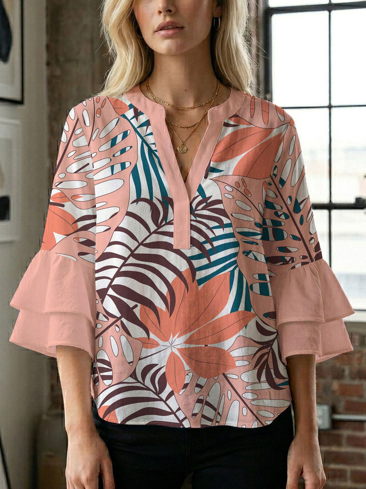 Dame bluse med voluminøse ærmer og kreativt trykdesign Skovae