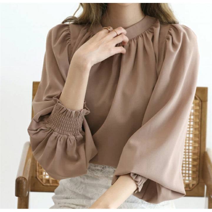 Kvindernes elegante bluse med voluminøse ærmer og opretstående krave Stilla