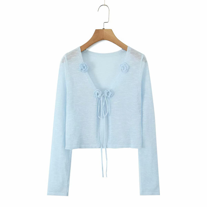 Dame cropped strikjakke med blomstrede accenter og elegant bindebånd Stilla