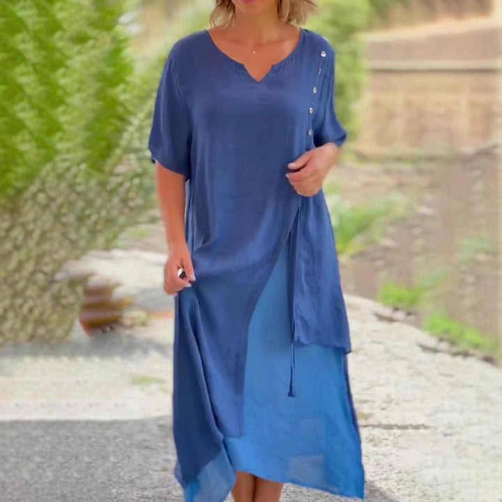Dame Strandkjole med asymmetrisk snit og elegante knapdetaljer Stilla