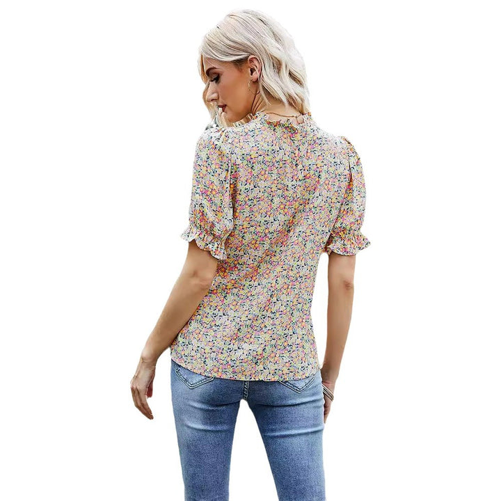 Damebluse med blomstermønster og puffærmer Stilla