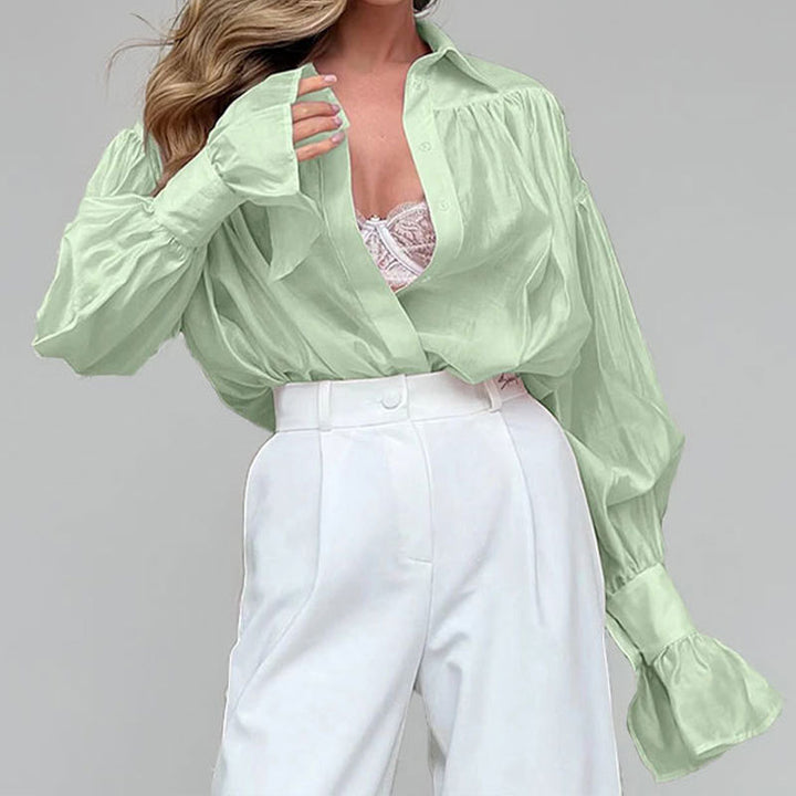 Kvindernes elegante bluse med løs pasform og ballonformede ærmer Stilla