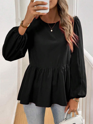 Damebluse med elegante sløjfedetaljer og voluminøse ærmer Stilla