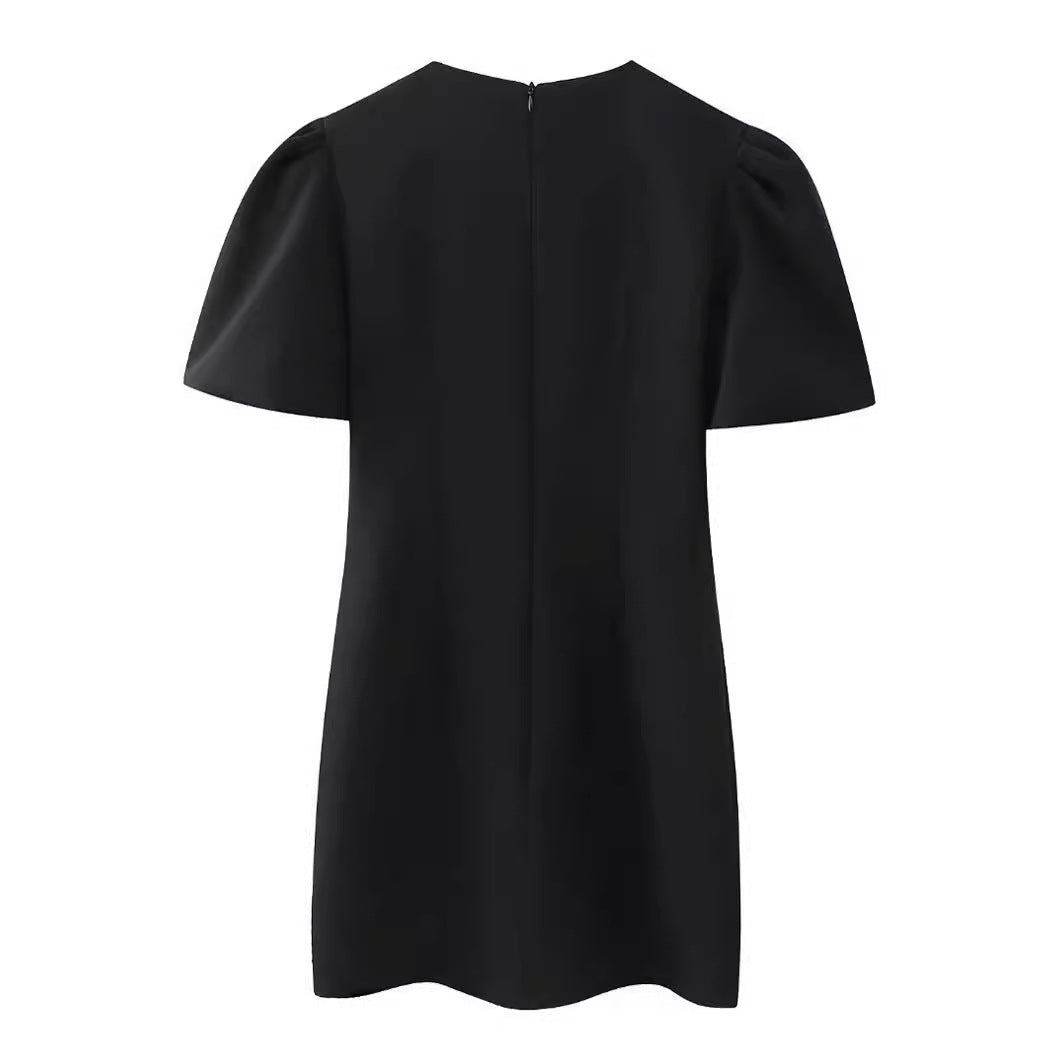 Damekjole med struktureret design og elegante sløjfeapplikationer Stilla