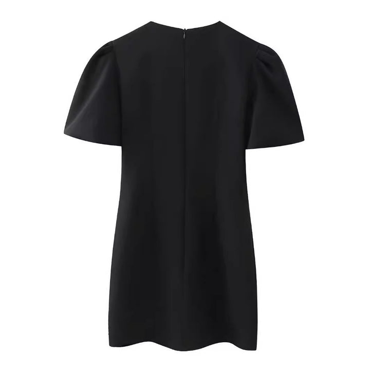 Damekjole med struktureret design og elegante sløjfeapplikationer Stilla
