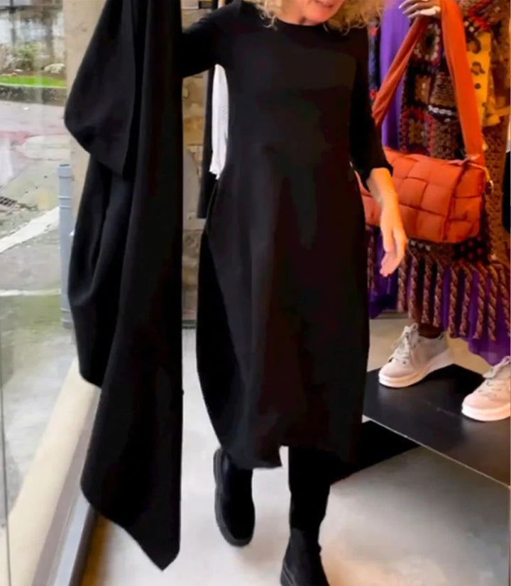 Dame asymmetrisk kjole med praktiske lommer og elegant design Stilla