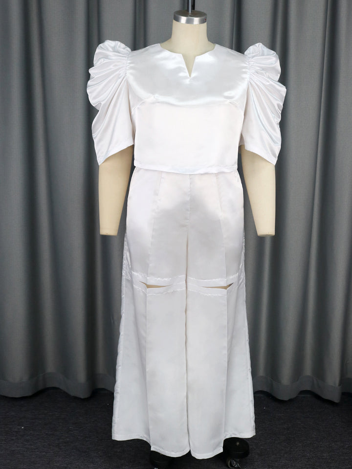 Damer Elegant jumpsuit med voluminøse puffærmer og smart talje detaljer Skovae